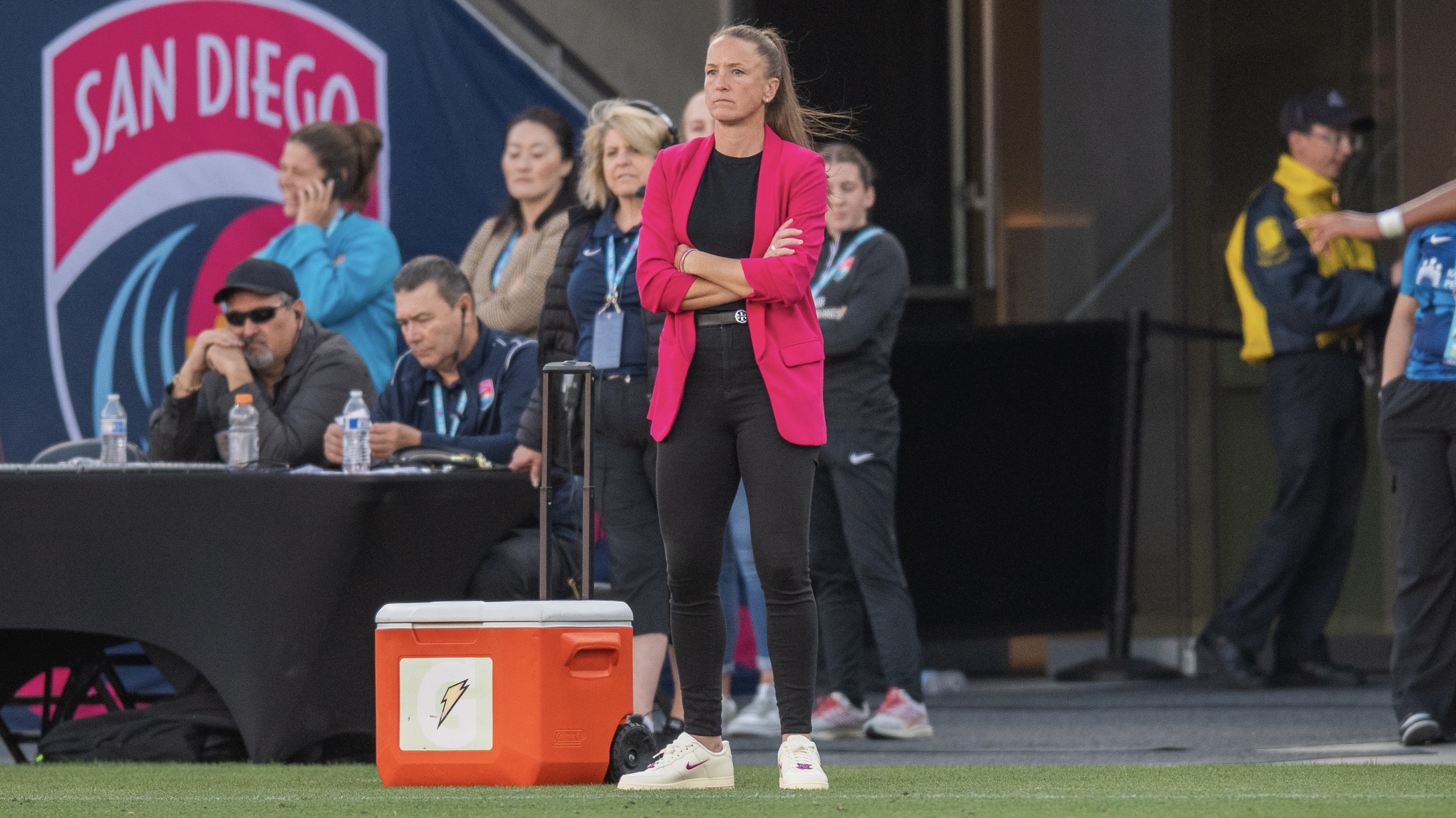 Casey Stoney stands with her arms crossed on during the San Diego Wave FC vs NJ/NY Gotham FC match on May 12, 2024 at Snapdragon Stadium in San Diego, Calif.